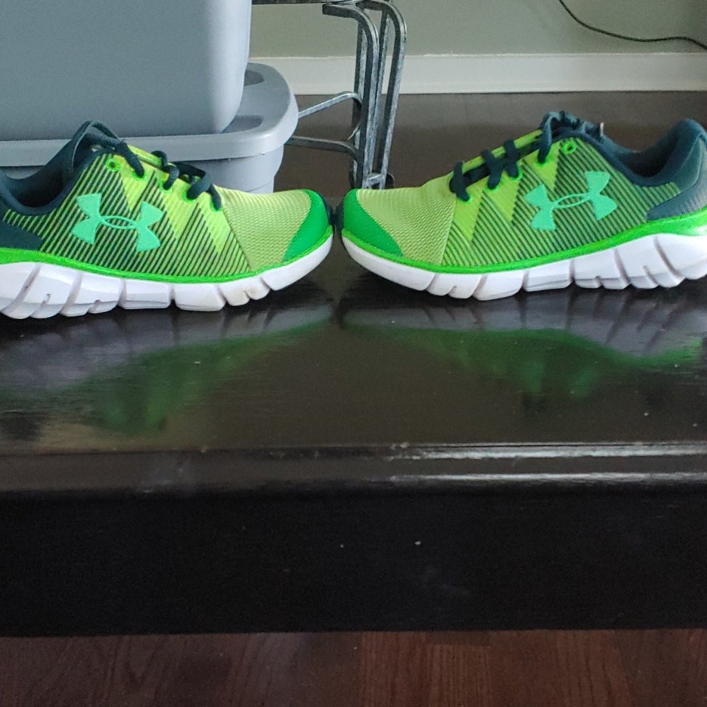 It's a green under Harmour shoes for kids
